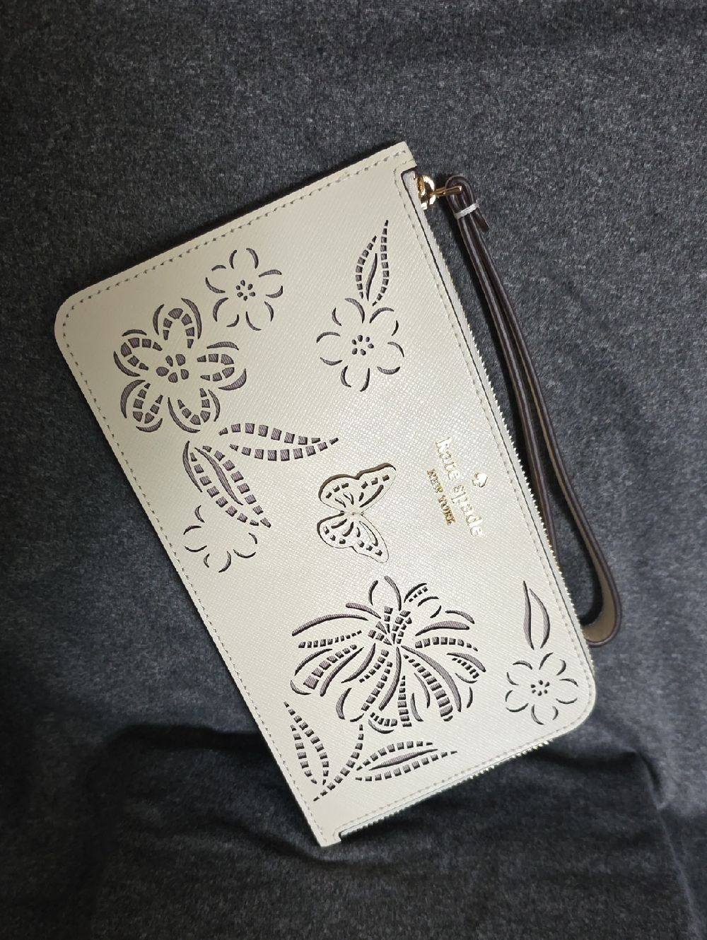 EUC kate spade Cream Wristlet with Floral & Butterfly Cutouts